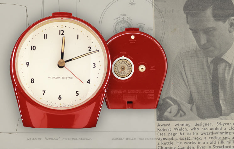 Red retro wall clock with white face and black numbers.